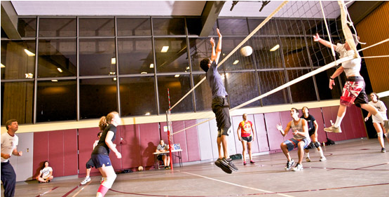 Students playing drop-in volleyball