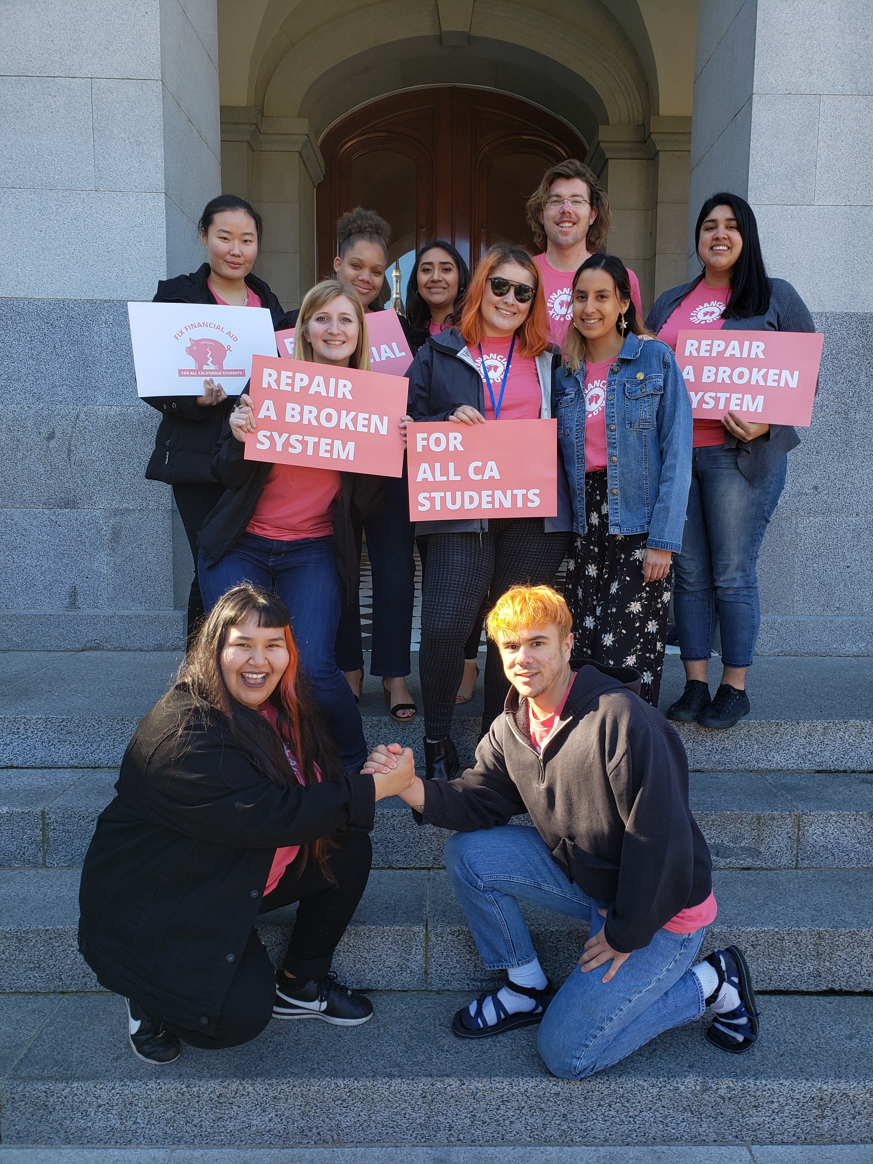 Nine Humboldt students (and one advisor) after the CSSA Rally on the State Capitol steps. At the rally, students from across the Cal State System advocated for legislators to fix financial aid so it acknolwedges the holistic costs of being a student